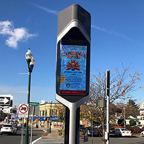 2019 Thanksgiving Parade flier on monitor in New Rochelle.