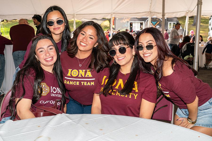 Group photo of five Iona alumni women posing and smiling at Homecoming Weekend 2025.