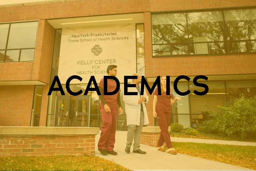 A professor walks with two students outside of the Kelly Center for Health Sciences.