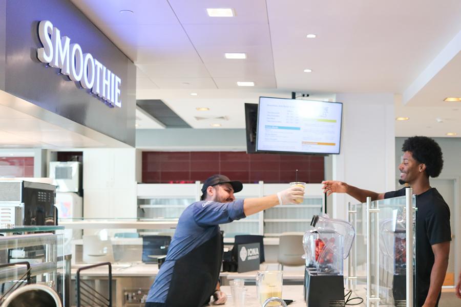 A basketball player receives his smoothie order.