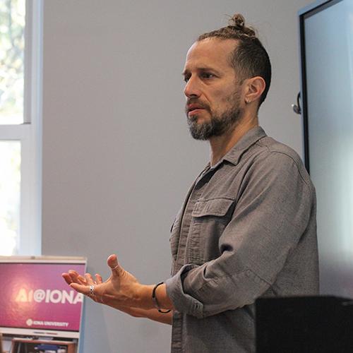 Dr. Burnett speaking at the GCTL.