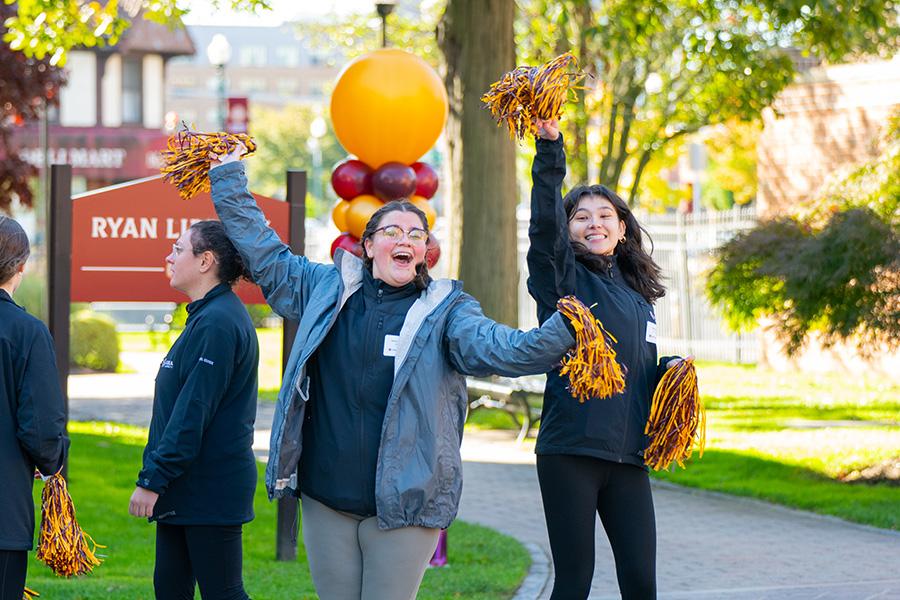 Gael Guides welcome people on Celebration Saturday.