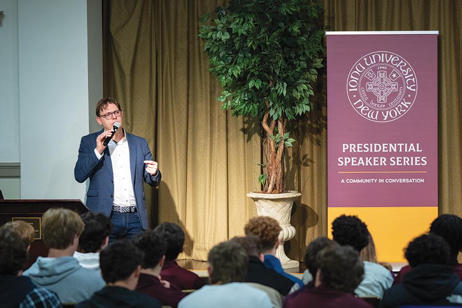 Tom Chatfield speaking in Romita Auditorium to a full audience.
