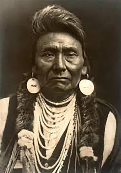 Chief Seattle in headdress.