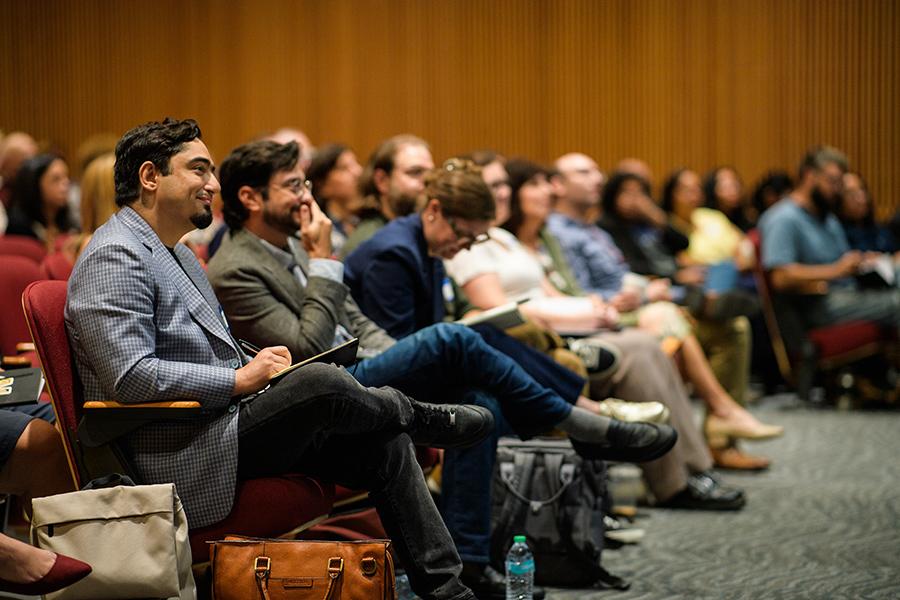 Audience members pay close attention at the conference.