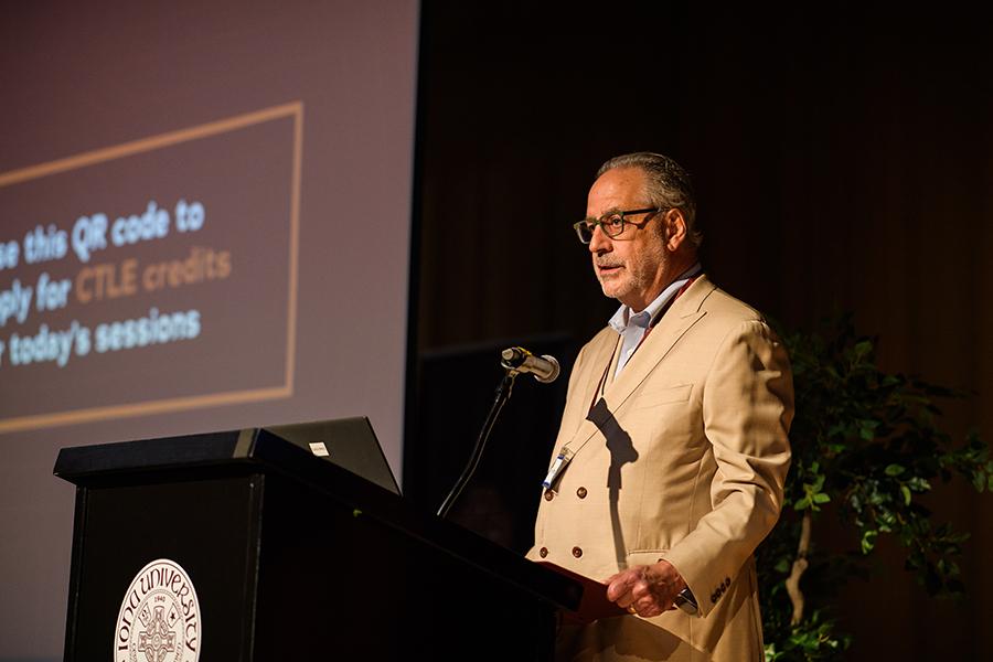 Jim Mustich gives opening remarks at the conference.