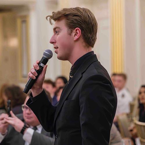 Connor Murray speaking at a conference.