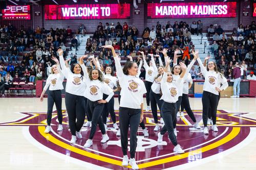 The dance team welcomes students to Maroon Madness.
