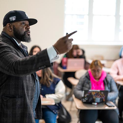 Dr. Pope teaching in a classroom.