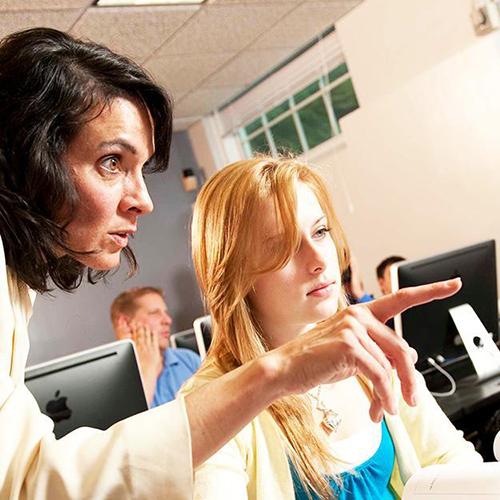 Dr. Zaino works with a student.