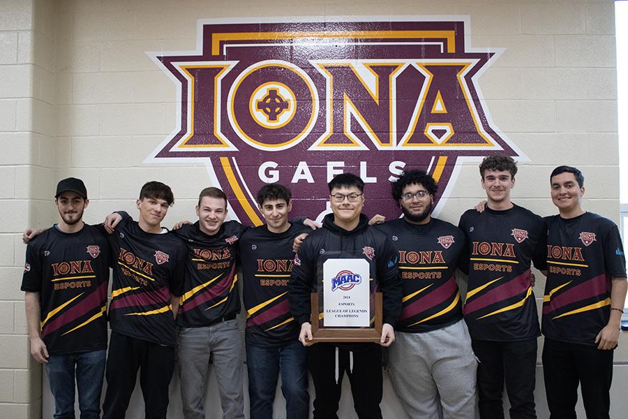 Esports team with their MAAC trophy.