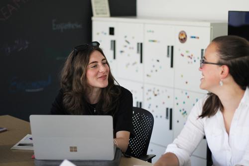 Two general experimental psychology students receiving faculty mentorship in class.