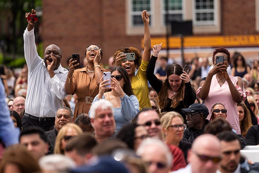 A family cheers at Commencement.
