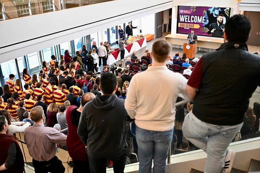 Dan Geriot speaking at the podium, view from the stairs of the LSB.