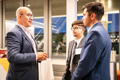 Students and alumni networking at the Gaels Go Further 5 Year Anniversary.