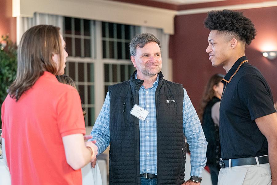 A Gaels Go Further mentor with two of his mentees.
