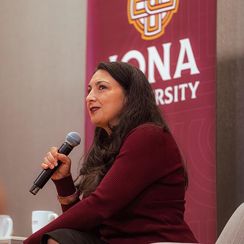 Shenan Reed speaking at the C-Suite talk.