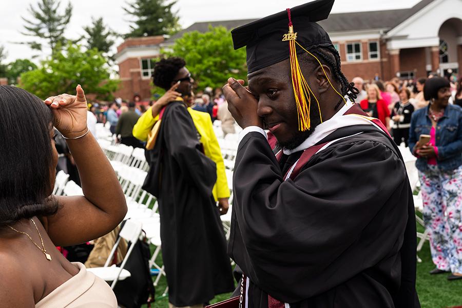 A graduate tears up at the 2024 ceremony.