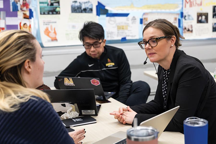 Teachers discuss AI@Iona with Dr. Hardigree.