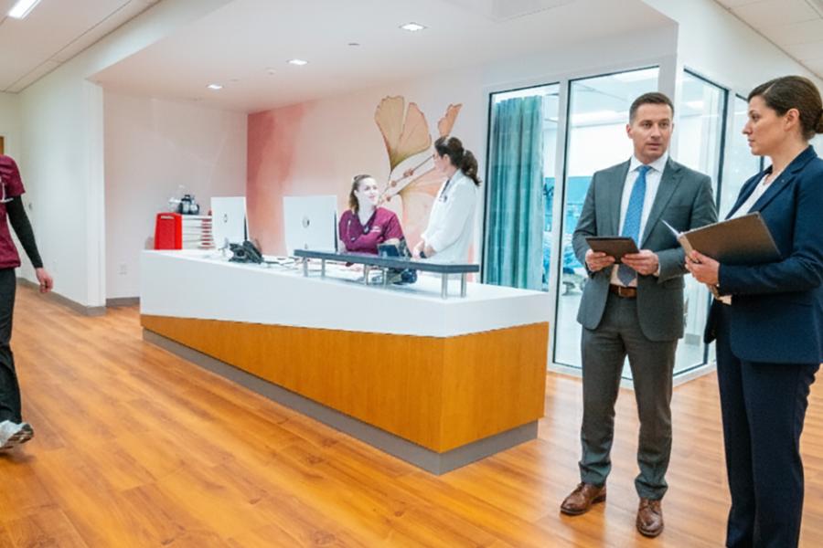 Two healthcare managers in a hosptial setting.