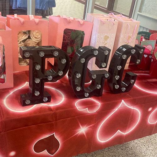 Phi Gamma Chi's table with PGC letters.