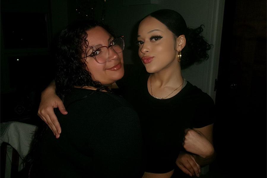 Two members of Phi Gamma Chi smile for the camera.