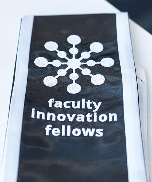 The Faculty Innovation Fellows insignia on a scarf.