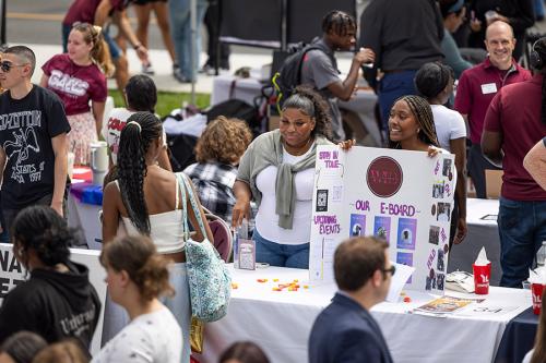 Students engage with a table at the Involvement Fair.