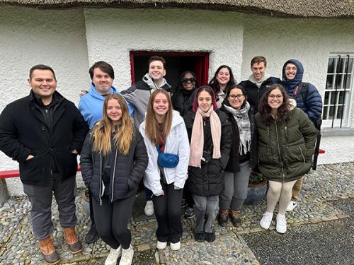 Iona in Mission students outside of a soup kitchen in Ireland.