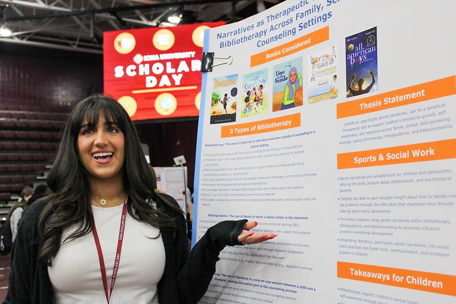 A student presents her work at Iona Scholars Day.