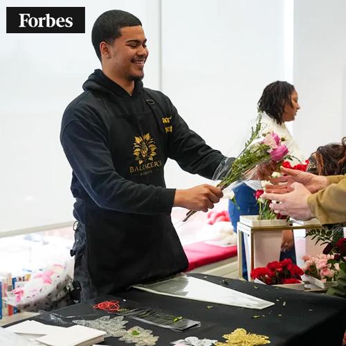 Jared selling one of his bouquets with the Forbes logo.