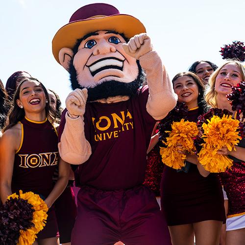 Killian the Gael with the cheer team.