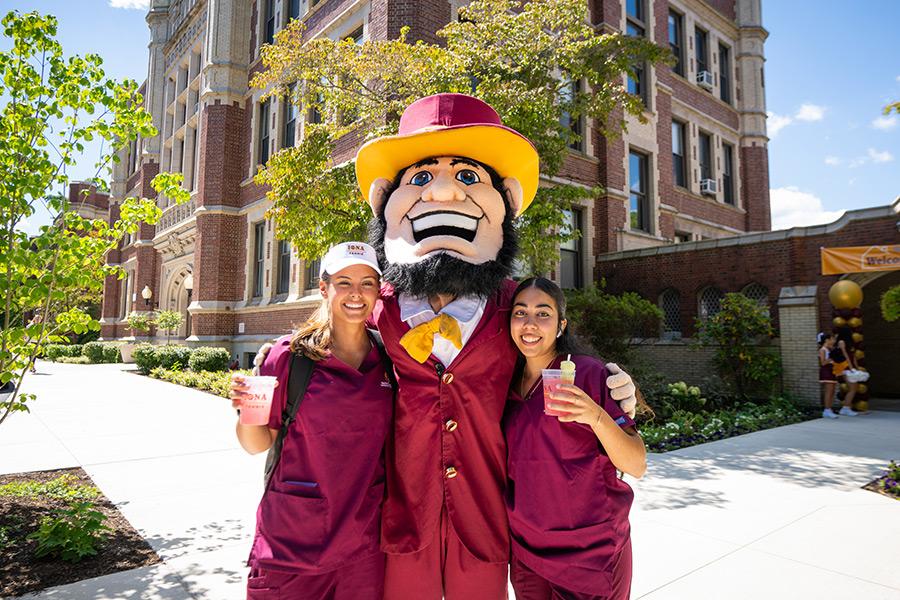 Killian with two nursing students at the Bohm Hall ribbon cutting.