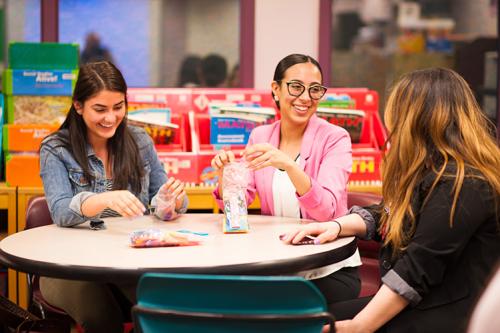 Literacy students practice teaching in a classroom. 