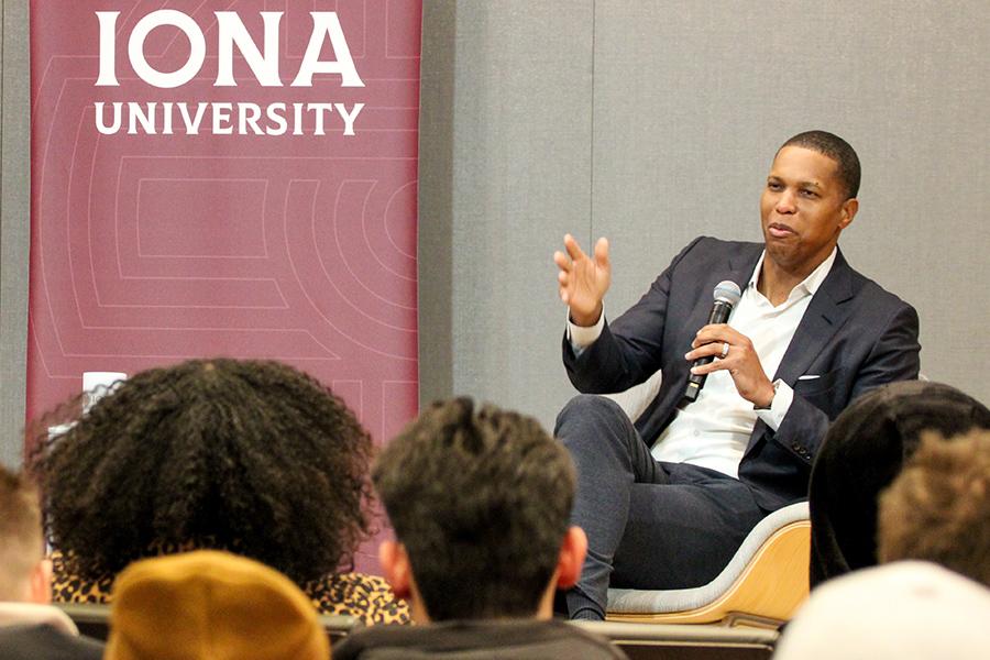 Mandell Crawley speaking at a C-suite talk.