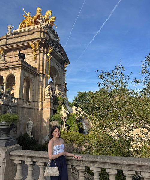 Natalie outside of arches in Barcelona.