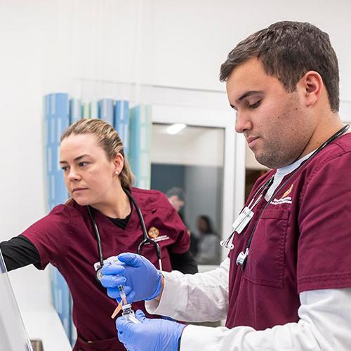 Two nursing students working in the Kelly Center.