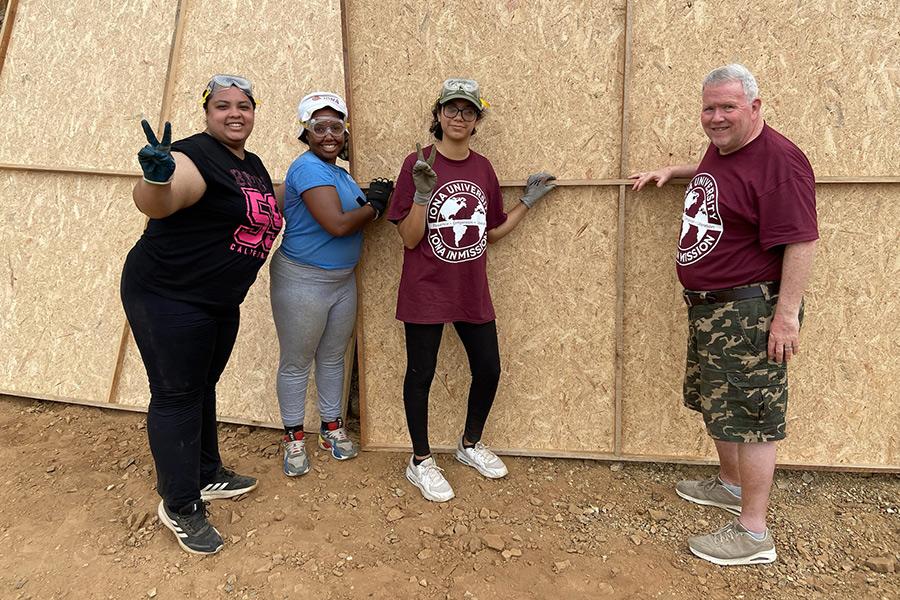 Students and Fr. Gerard help build a home in Peru.