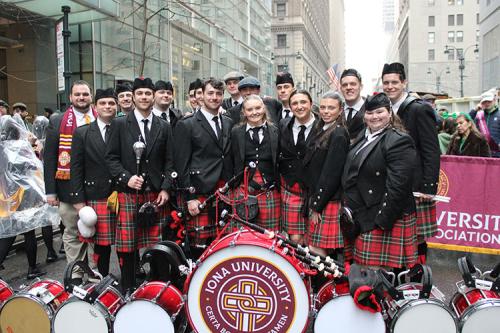 A group photo of the Pipe Band in NYC.