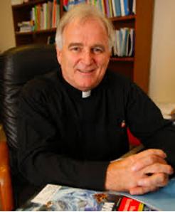 Seamus Finn photo at desk.