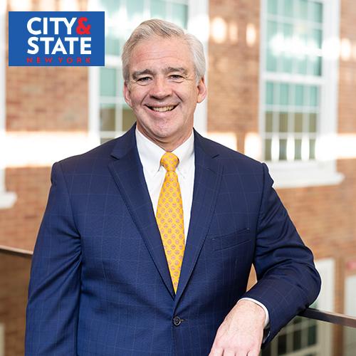 President Carey with the City & State New York logo.