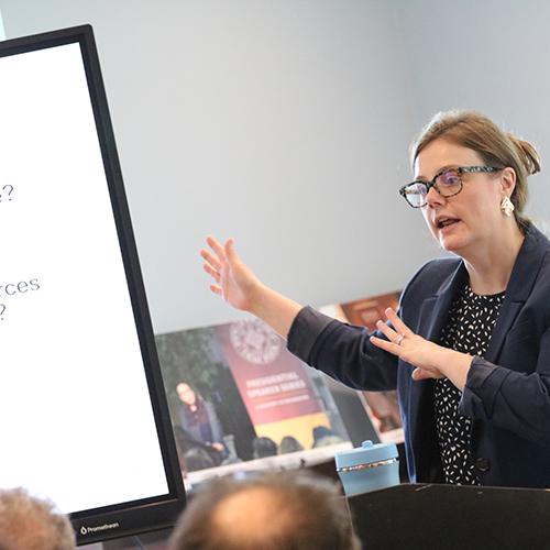 A professor presents on the topic of AI.