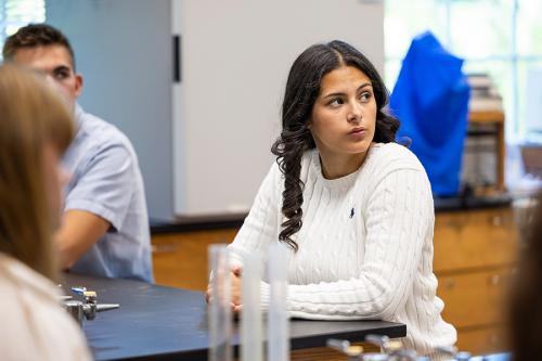 A student in the public health minor in the biology lab.