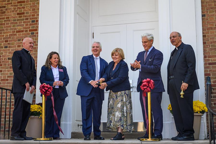 Leadership, clergy and the Gabelli family cut the ribbon.