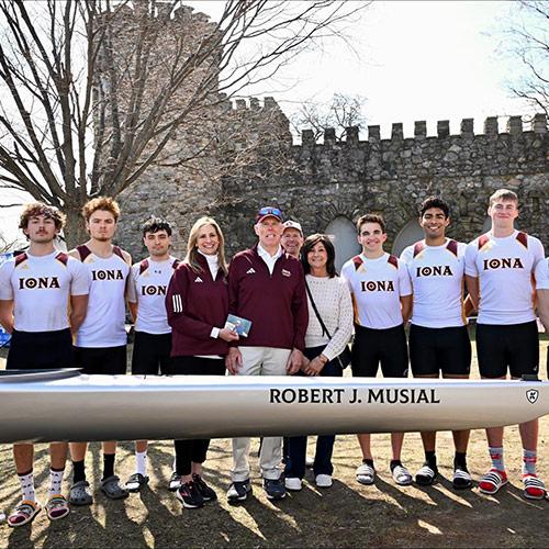 Robert Musial with his wife and the rowing team at the shell christening.