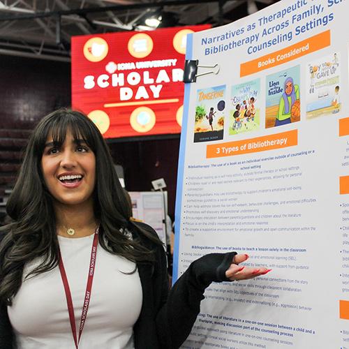 A student presenting at Scholars Day.