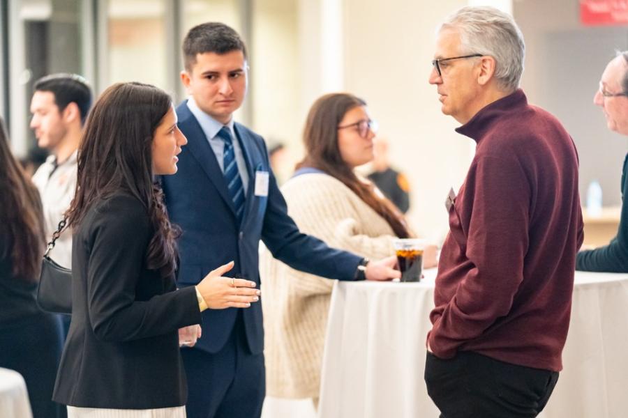 Networking at Gaels Go Further Mentoring Programs event.