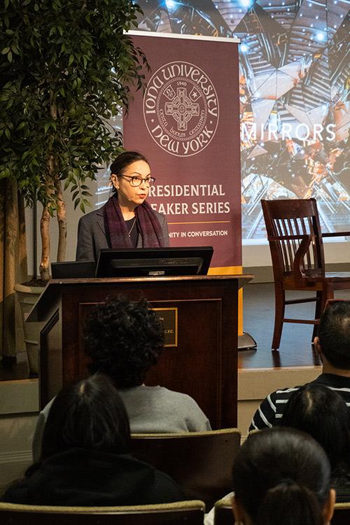 Shannon Vallor speaking at the podium.