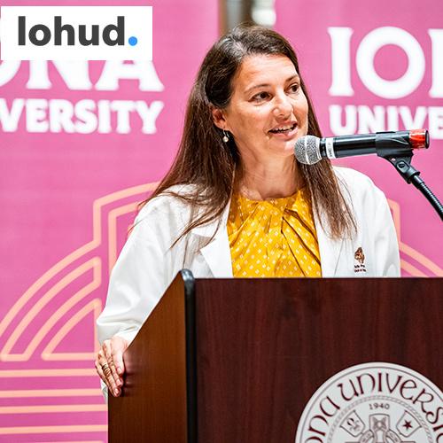 Shery Watson speaks at a podium with the Lohud logo.