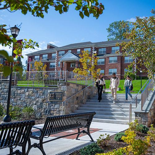 Three students walk by the Murphy Green.